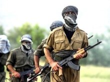 Iraq - A PKK (Kurdistan Workers Party) fighter jog during a training session, at the Amedia area in Northern Iraq, 10 km near the Turkish border, 20Jun2007