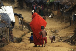 A Rohingya refugee walks through Kutupalong Makeshift Camp, Sept. 9, 2009.