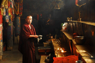 A monk tends a shrine at a monastery in the Tibet Autonomous Region, April 7, 2007.