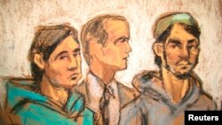 Akhror Saidakhmetov (left) of Kazakhstan appears in a Brooklyn federal court in February 2015.