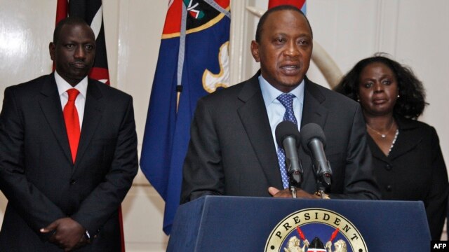 Kenyan President Uhuru Kenyatta speaks during a press conference in Nairobi in front of Kenyan Vice President William Ruto (left) on September 24.