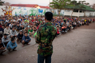 A guard lectures detainees in Somsanga center in Vientiane, February 2011.