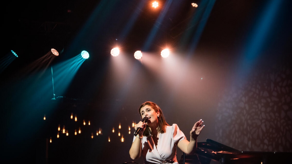 Syrian singer and refugee, Manal Samaan, performs one of two songs during the ceremony.