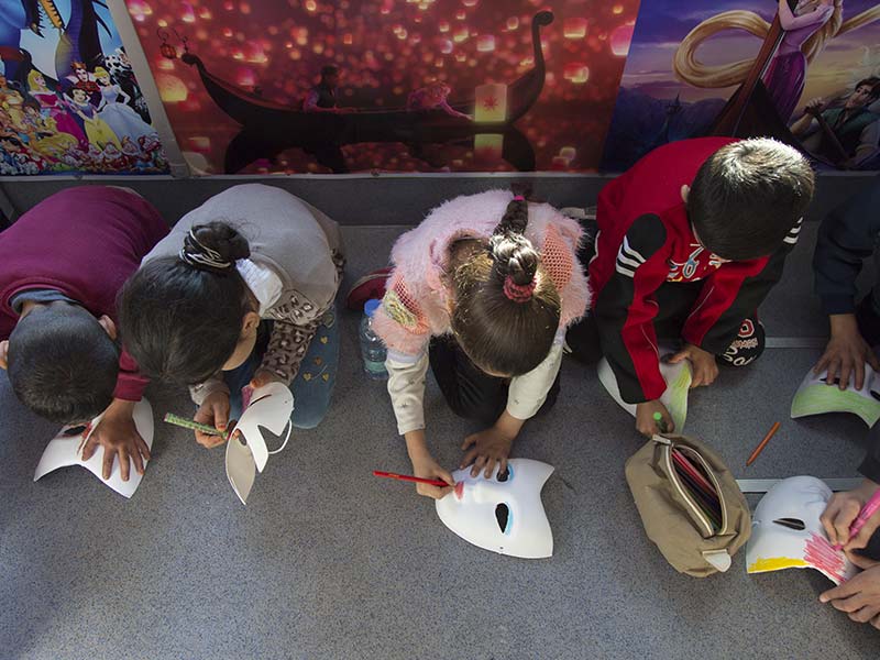 Lebanon. Syrian refugee children enjoy respite on the Fun Bus © UNHCR/Dalia Khamissy