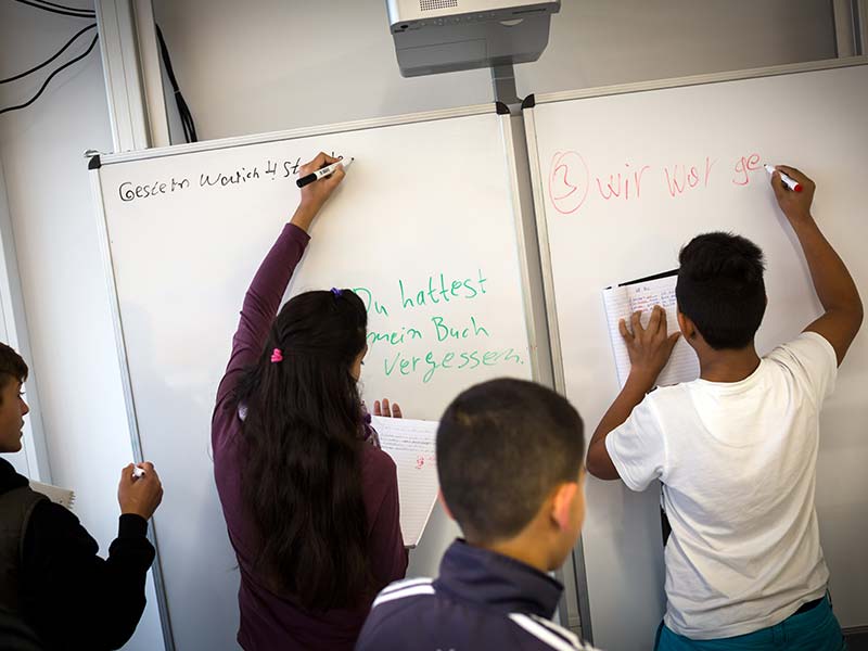 Germany. Beginner classes teaching refugees in German language. © UNHCR/Gordon Welters