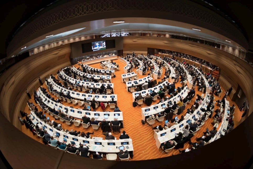 Participants take their seats at the High Commissioner's Dialogue at the Palais des Nations in Geneva.