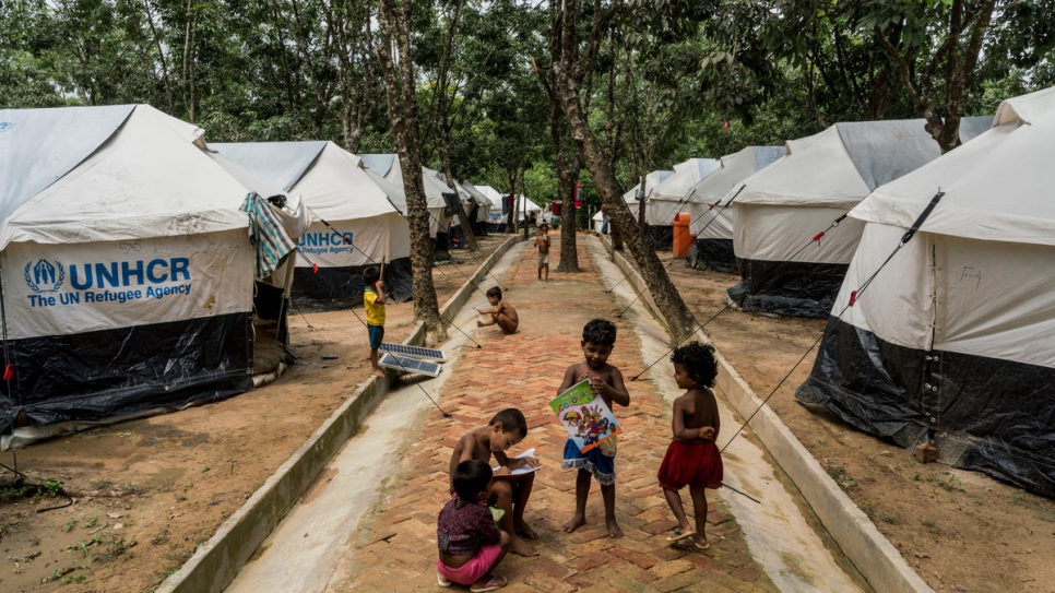 Recently arrived Rohingya refugees play at the UNHCR Transit Centre in Kutupalong, Bangladesh. 