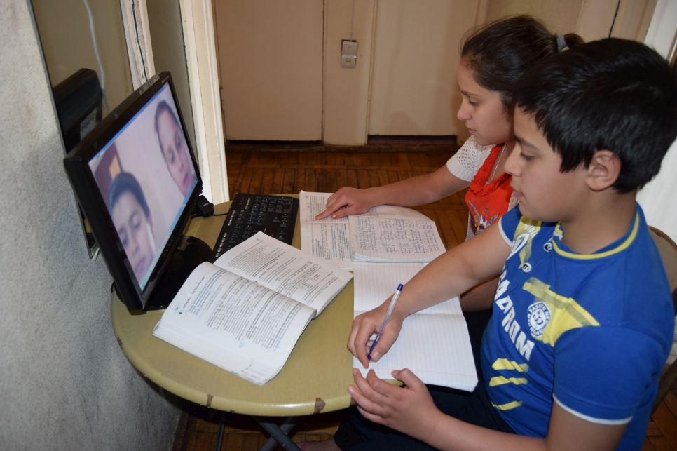 Twelve-year-olds, Sahag and Salpie*, are twins from Syria whose family have sought protection in Armenia. The siblings are taking Zoom classes on a computer lent to them by their teacher, after their school in Yerevan was closed because of coronavirus prevention measures.