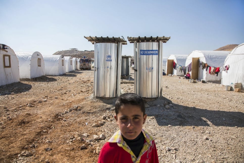 Lebanon / Syrian Refugees / A young refugee is pictured in an informal tented settlement in Arsal, Lebanon, on 17 February 2014. Thousands of Syrians have crossed the border into Lebanon in recent days after regime forces began to attack the town of Yabrud and its surrounds. UNHCR registered over 800 families on Monday alone and has been disributing aid to thousands of new refugees. / UNHCR / A. McConnell / February 2014