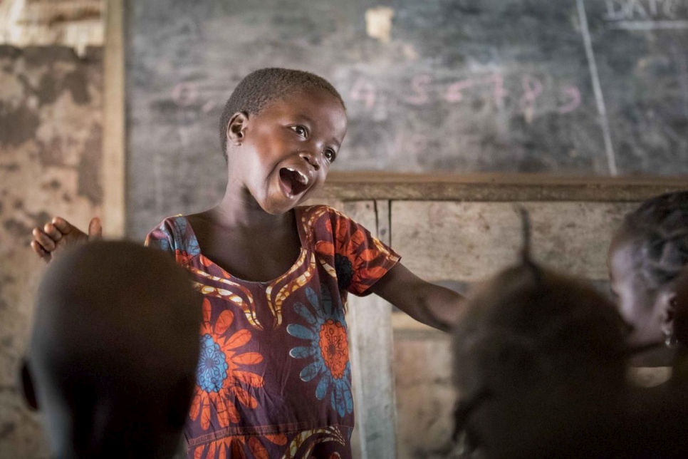 Six-year-old Gambolipai Martha leads the other children in a song during a pre-school class at Makpandu refugee settlement in South Sudan. Some 400 students, including local South Sudanese children and Congolese and Sudanese refugees, attend the school which was founded in 2019 by refugee community group, the Youth Association for Peace and Development. 