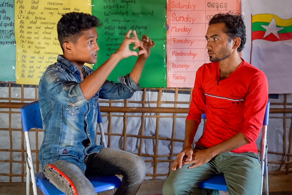 Hasson with his friend and mentor Sahat Zia Hero (right), who has been teaching him photography.