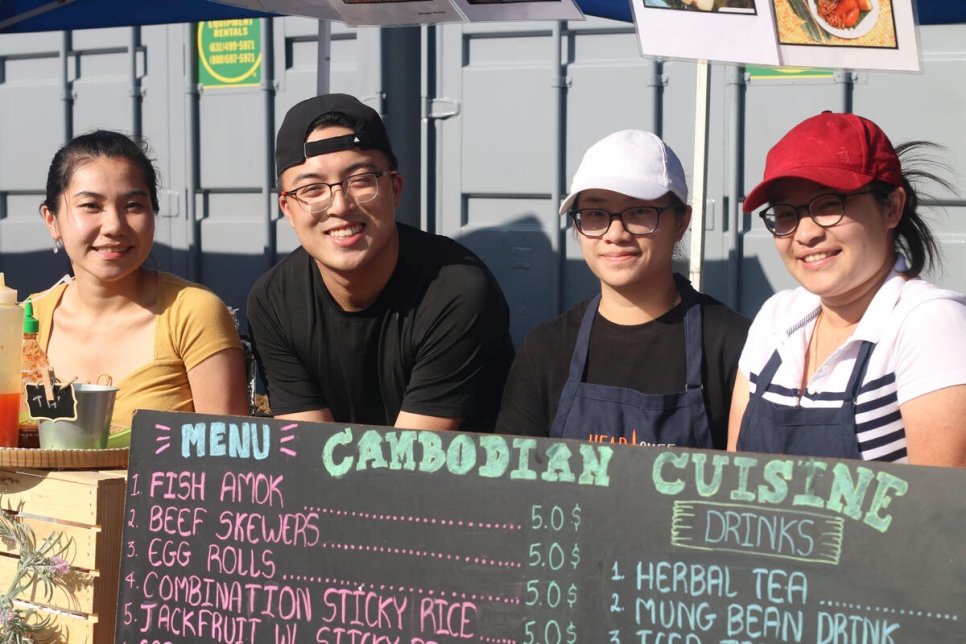 USA – Sokhita Sok, friend and sisters at her stand at Queens Night Market.