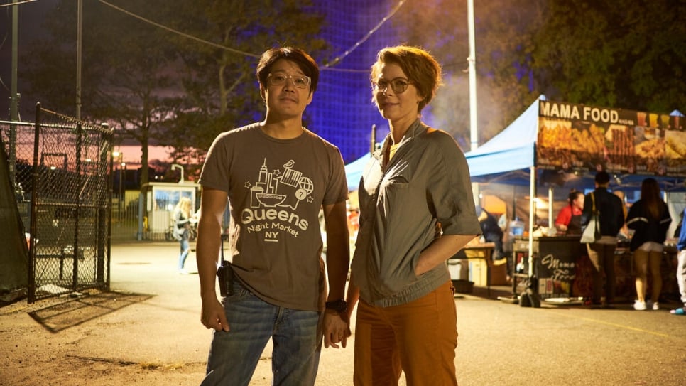 John Wang, founder of the Queens Night Market, and his wife, Storm Garner. The couple also wrote a cookbook, The World Eats Here, with recipes from the market.