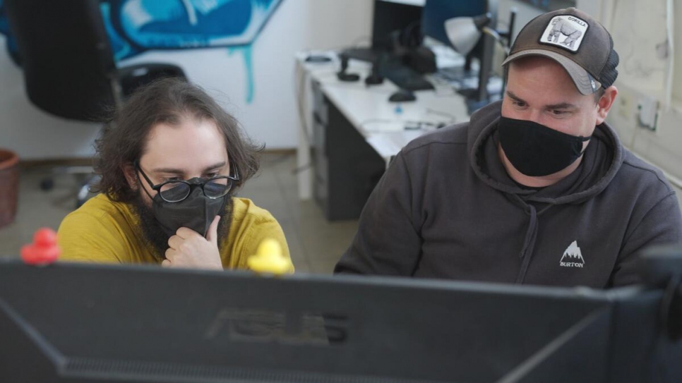 Game designer Jack Gutmann (left) sits alongside Georg Hobmeier, head of Causa Creations, at their offices in Vienna, Austria.