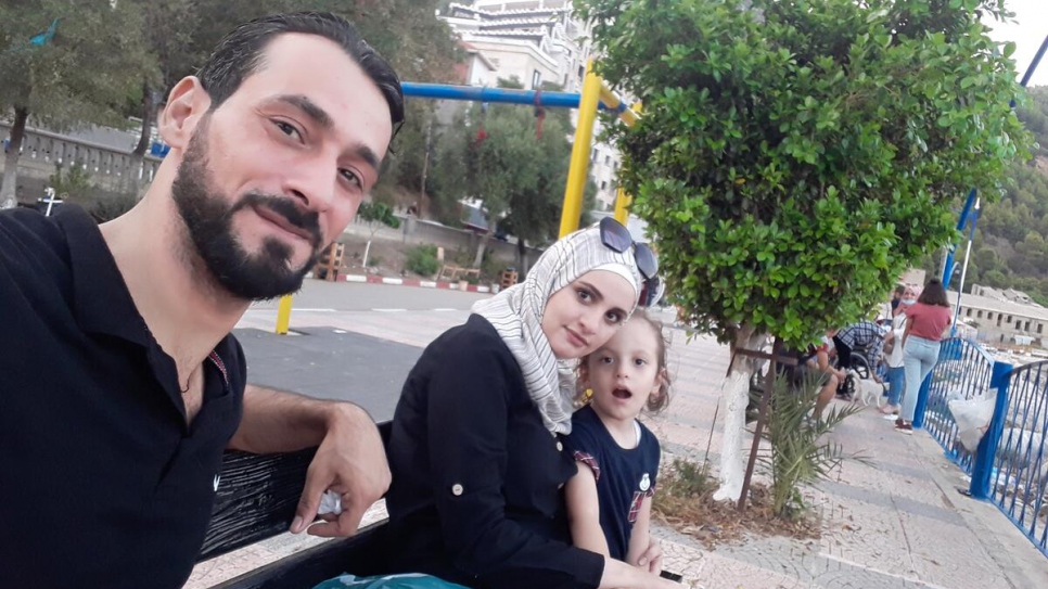 Mohammad Adam, originally from rural Damascus, with his wife and daughter in Algiers, Algeria. 