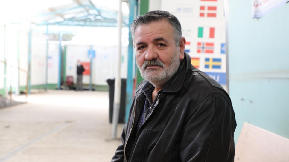 Syrian refugee Mahmoud, 53, at a UNHCR registration centre in Amman, Jordan. 