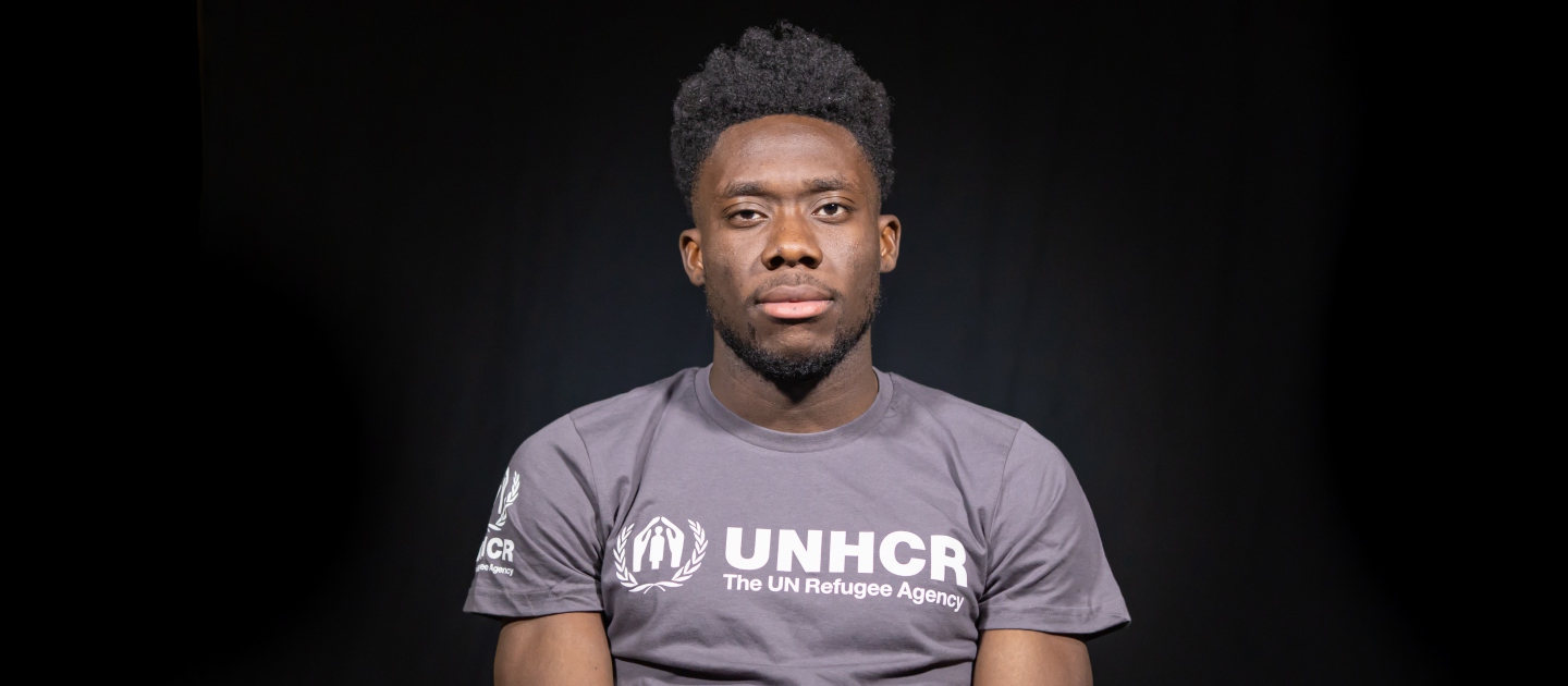 Alphonso Davies, Left Back for FC Bayern Munich and Canada Men's National Team wearing UNHCR t-shirt.