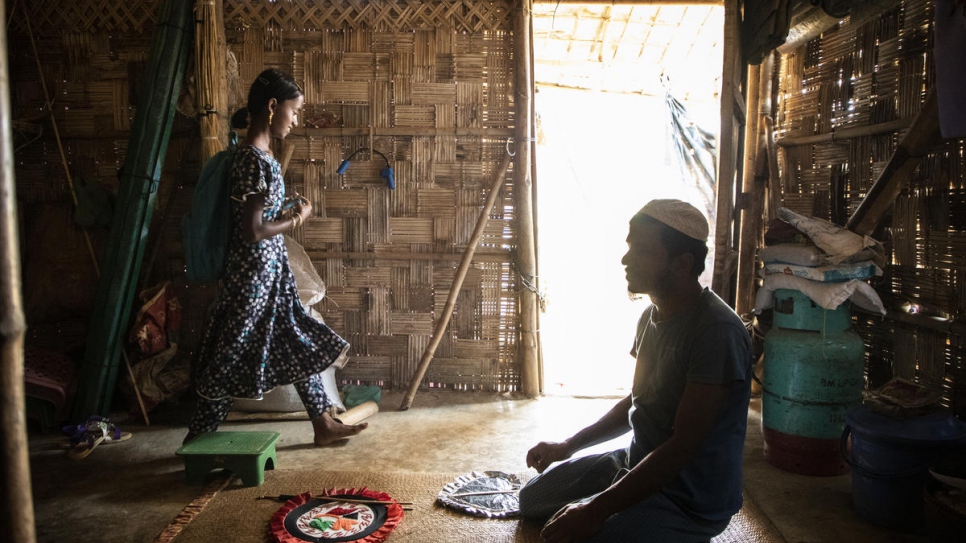 Myshara at home with her father. 