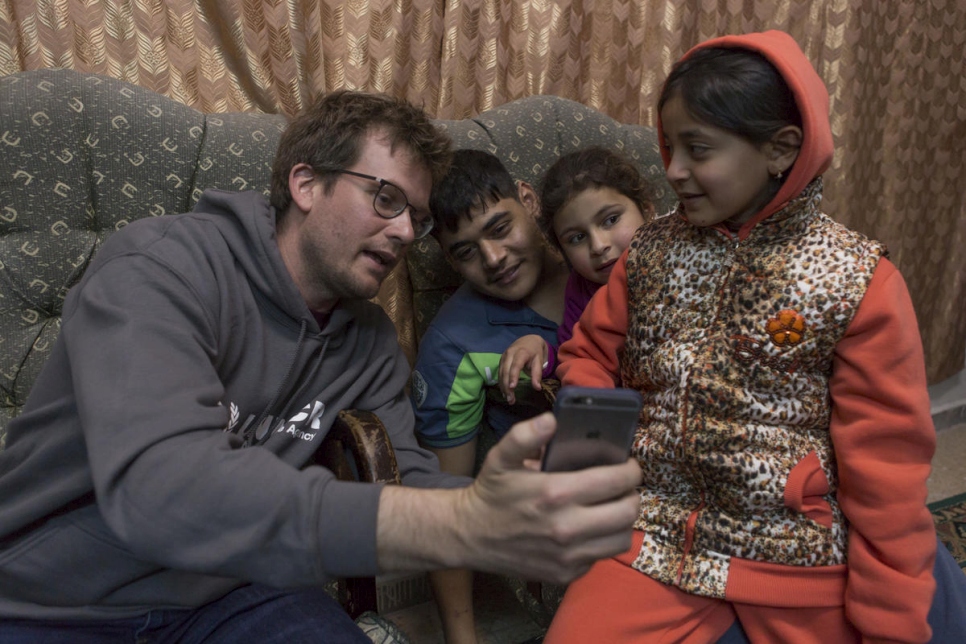 Jordan. UNHCR High Profile Supporter John Green meets Syrian refugee Abu Mustafa and his family