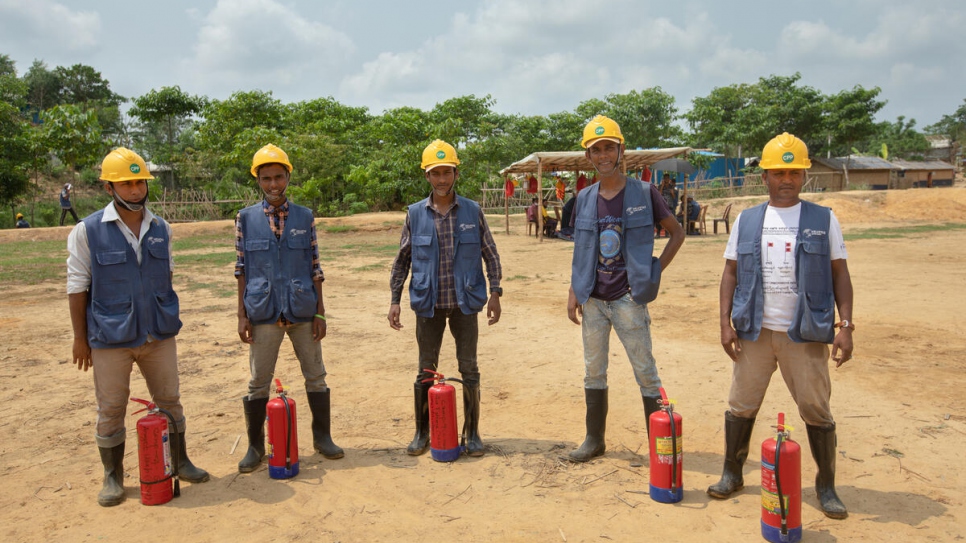 All of the camp's 3,500 refugee volunteers are equipped with fire extinguishers.