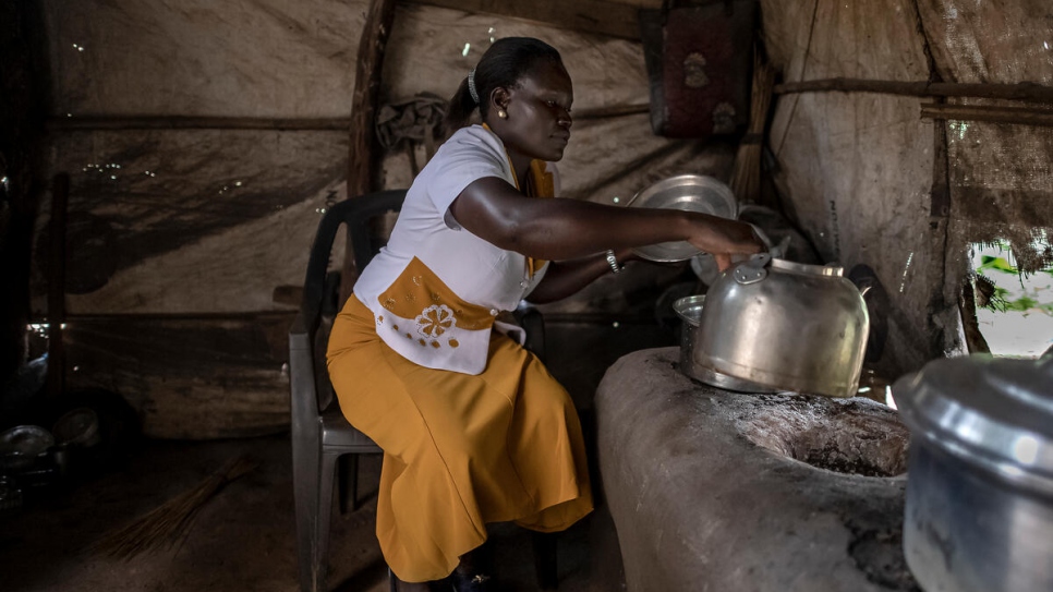 Anyek Rose John, founder of the Magwi Payam Women's Association, prepares breakfast for patrons of her restaurant at Magwi trading centre. 