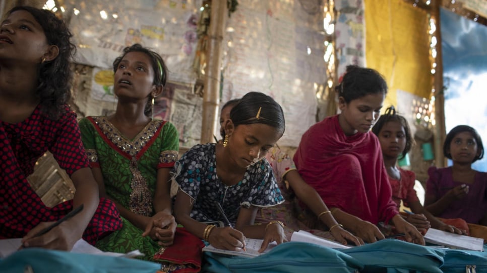 Myshara (centre) attends a class at a learning centre in Kutupalong camp before such centres closed as part of lockdown measures.