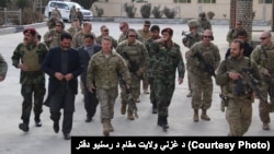 General Austin Miller (center), U.S. Army commander in Afghanistan, meets with the governor of Ghazni Province on November 21.