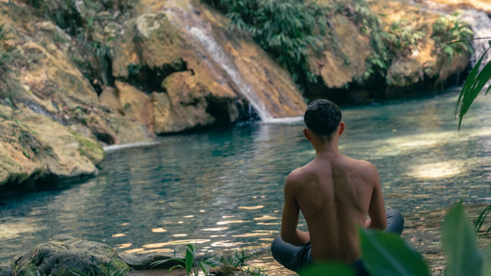 Joshua enjoys a quiet moment in the FUNDAECO preserve, a lush enclave of tropical trees and crystalline streams.  