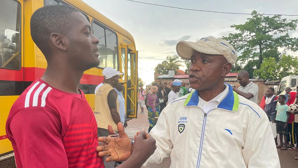 Team coach Djibril Mukandila (right) talks with his assistant, Miguel Baptista. 