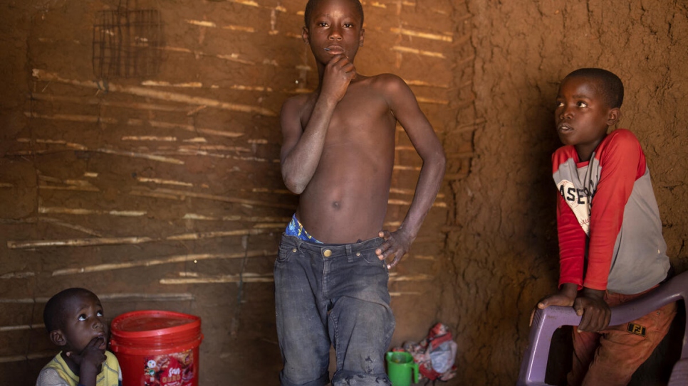 Bukuru, 14, Dorotea's son, in a temporary shelter in Maratane, with two of his brothers. Their previous home was destroyed by Cyclone Gombe. 