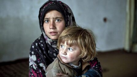 Two internally displaced sisters from Jalalabad pictured in their temporary accommodation in Kabul, Afghanistan. © UNHCR/Andrew McConnell