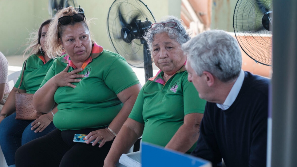 Members of the MOMUCLAA women's organization explain the travails they have gone through to High Commissioner Filippo Grandi.