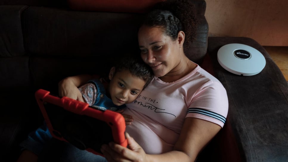 Desiree can now use a tablet at home with her youngest daughter Camila, 6, thanks to the new internet service in her community.