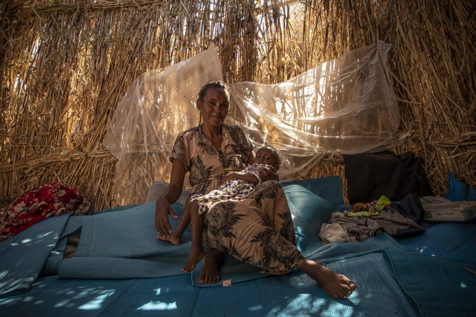 "We were in our house when soldiers started shooting at each other. Our house started burning. We ran away and started walking to Sudan. It took three days. We slept at night in the forest. The Sudanese gave us things to eat and a place to sleep."

Ethiopian refugee, Ngesti Gudamadhen, 28, is living with her husband, Asmelash Alemayoh, 33, their son Arbil Asmelash, 7, and their daughter Adiam Asmelash, 2, in a shelter in Um Rakuba camp, Sudan. She is a volunteer teacher in the camp.