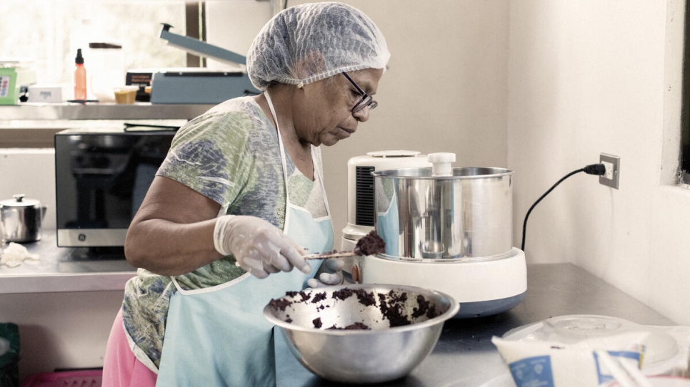 Vicenta processes dried and ground cacao beans into a paste that will be used to make chocolate and other cacao-based products sold under the association's Cacaotica label.