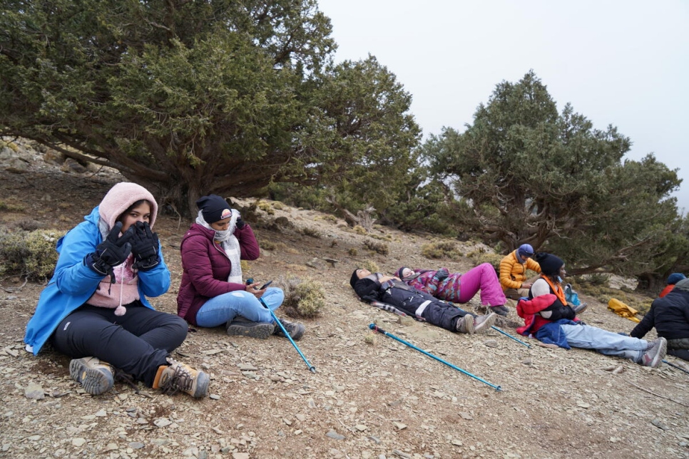 Morocco. Refugee women climbing the Toubkal.