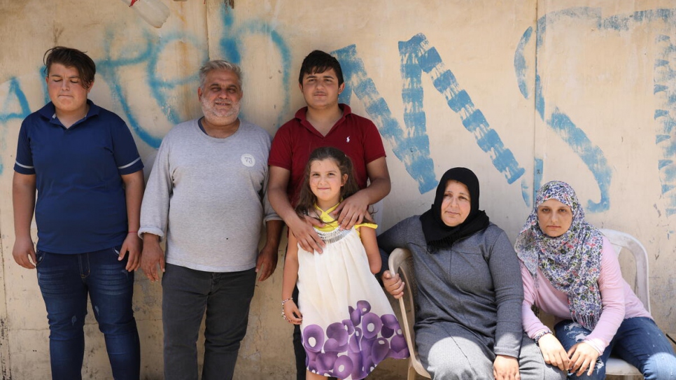 Sarah pictured with her parents and older siblings.