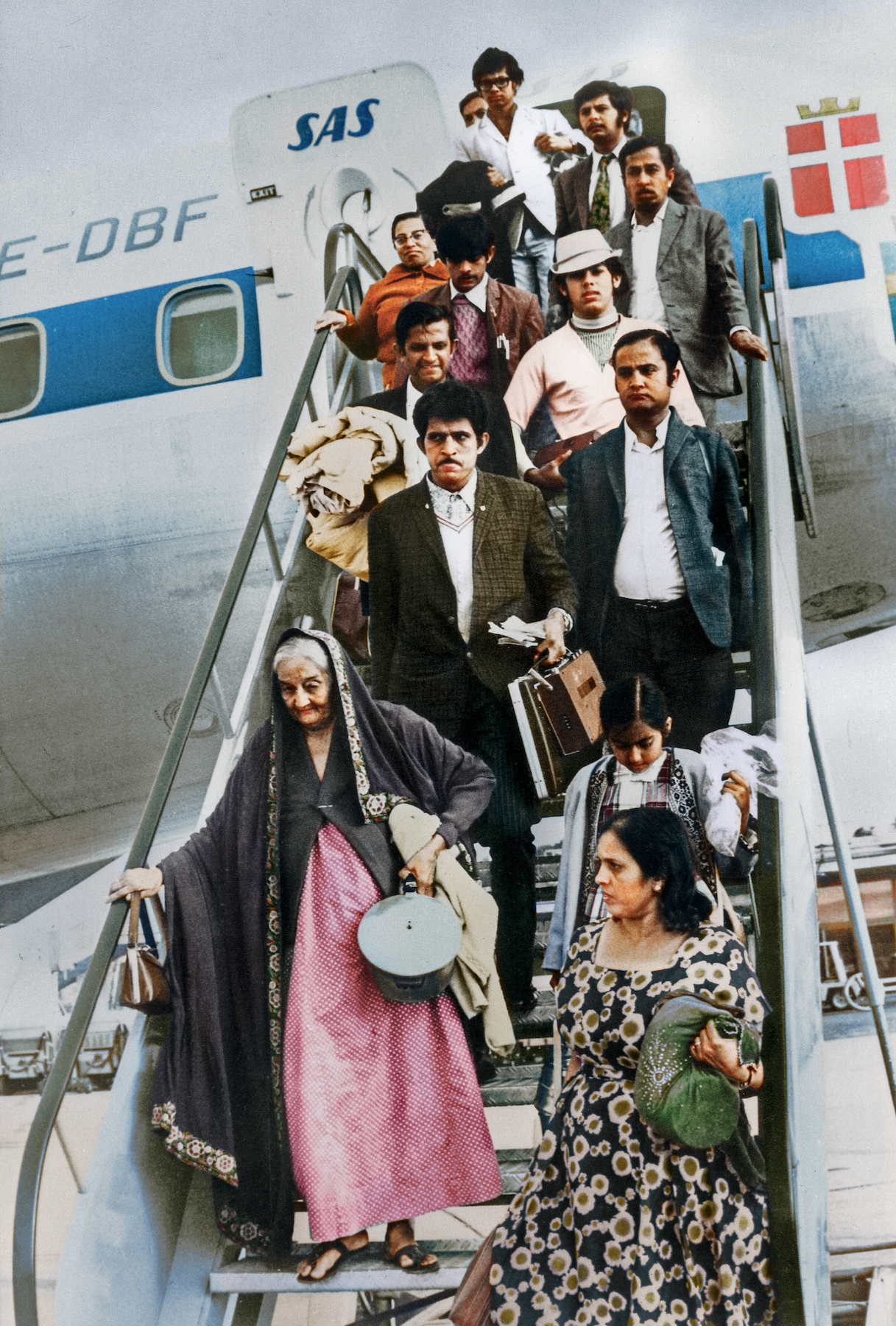 Arrival at Vienna airport of Uganda Asians, 1972. Colorized picture