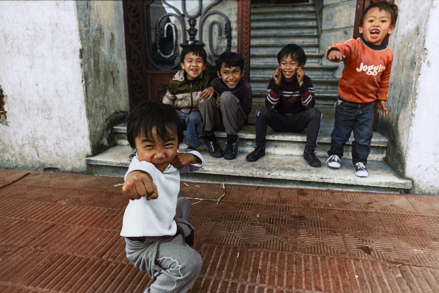 Young refugees from Laos in Buenos Aires, Argentina, 1983 . Colorized picture