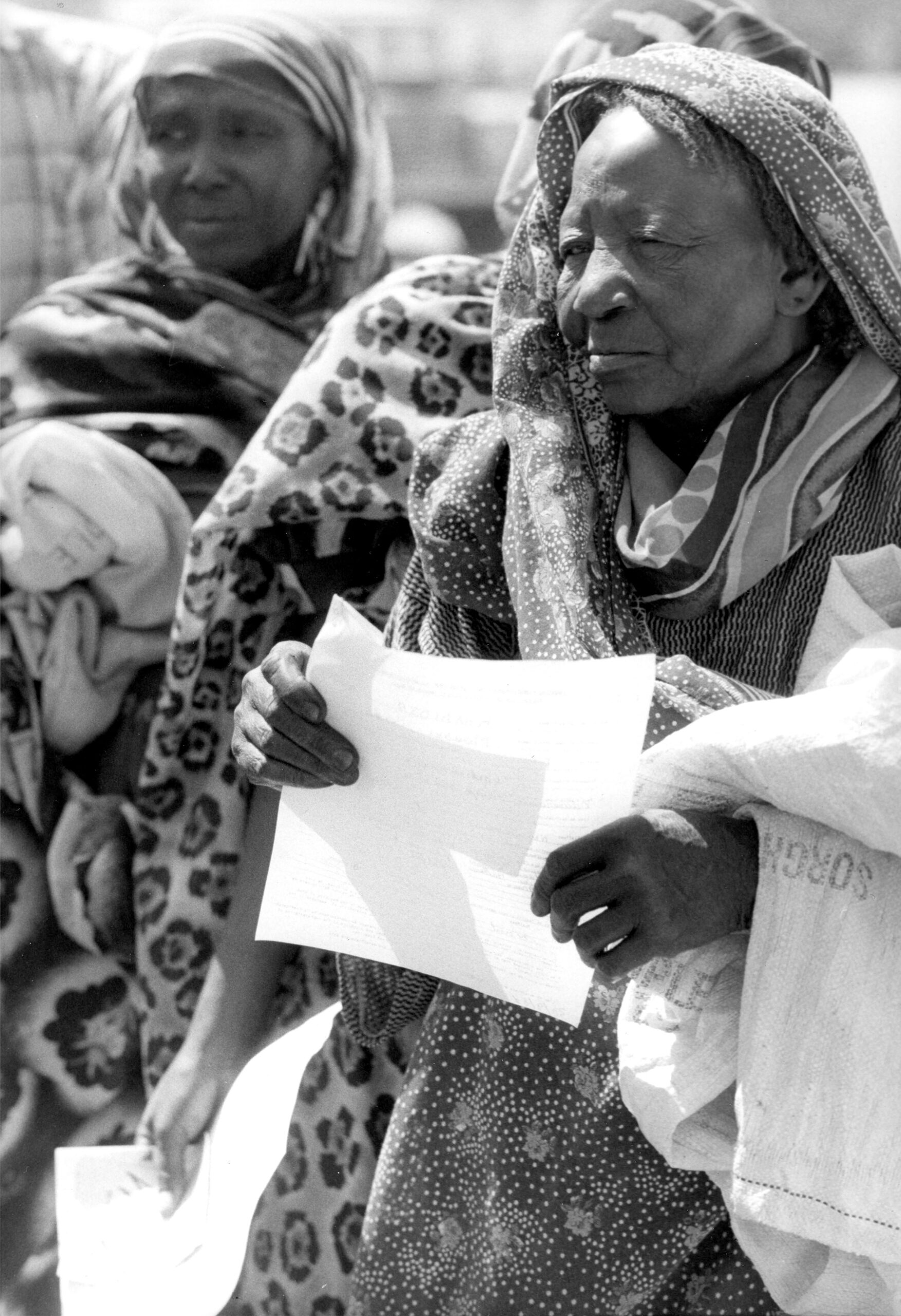 Women at Kousseri refugee camp in Cameroon prepare to be repatriated to Chad, 1981. Original Black and white picture