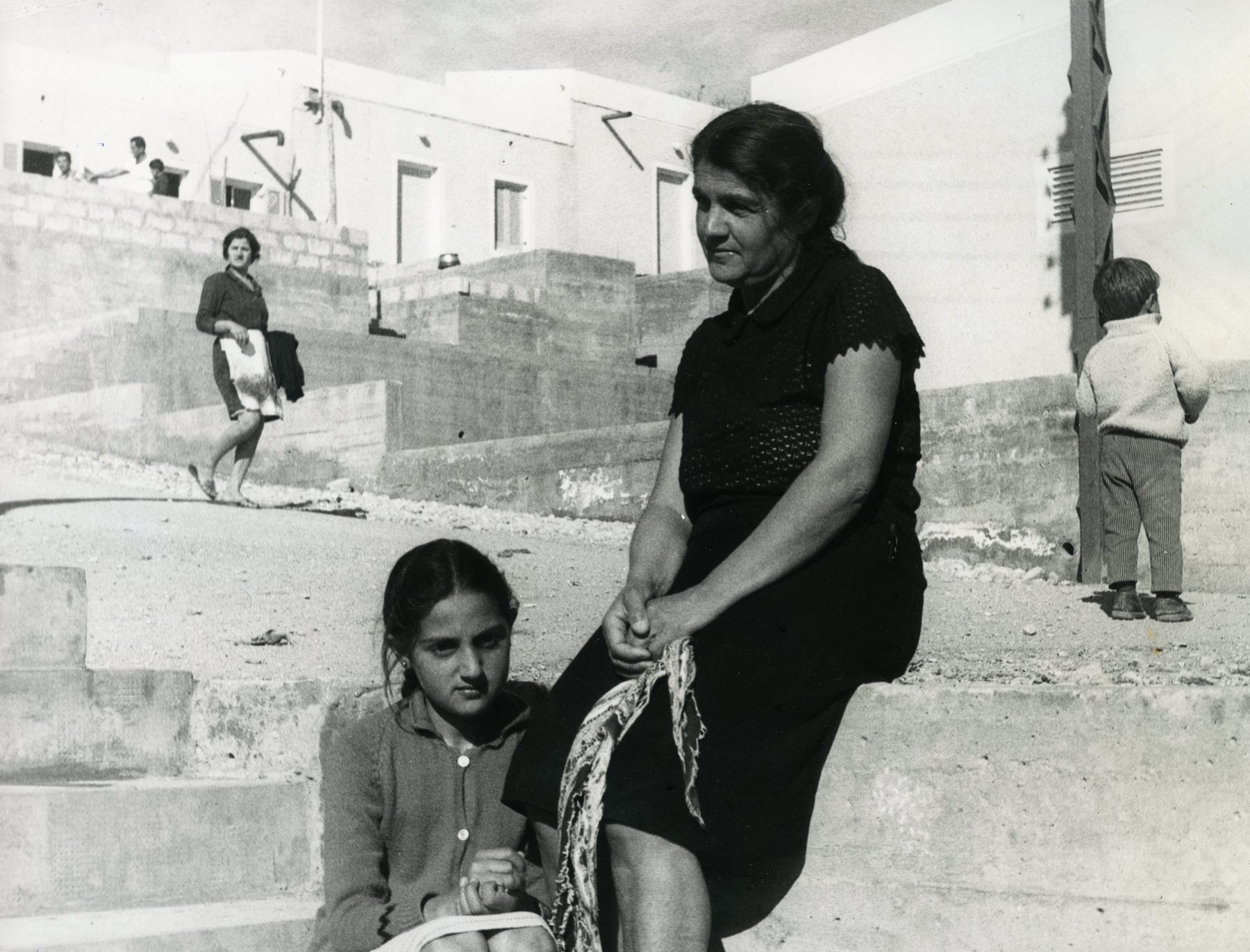 An Assyrian mother and child sit outside a refugee housing settlement in Lebanon’s Bekaa Valley in 1969