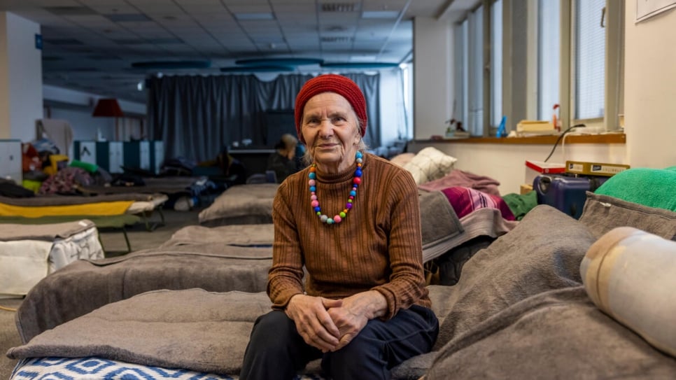 Valentina, 83, sits on her bed at a shelter in Kraków. Her New Year wish is to return to Ukraine.