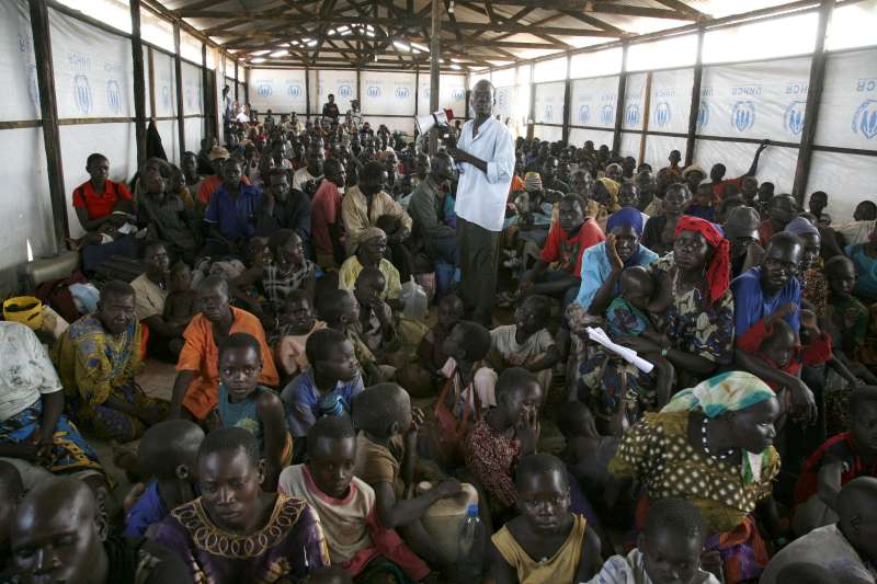 Sudan / Returning refugees receive information on HIV aids, and on landmines and the prevention of accidents, at the way station of UNHCR on the Sudanese border.
Returning refugees are supported by UNHCR, in a project of the Dutch Lottery, in which different organizations work together to assist the returning refugees, and IDPs on their way back home, from northern Uganda towards Southern Sudan. UNHCR takes care about the transport of people, goods, and their animals. Nimule, South Sudan. / February 2008