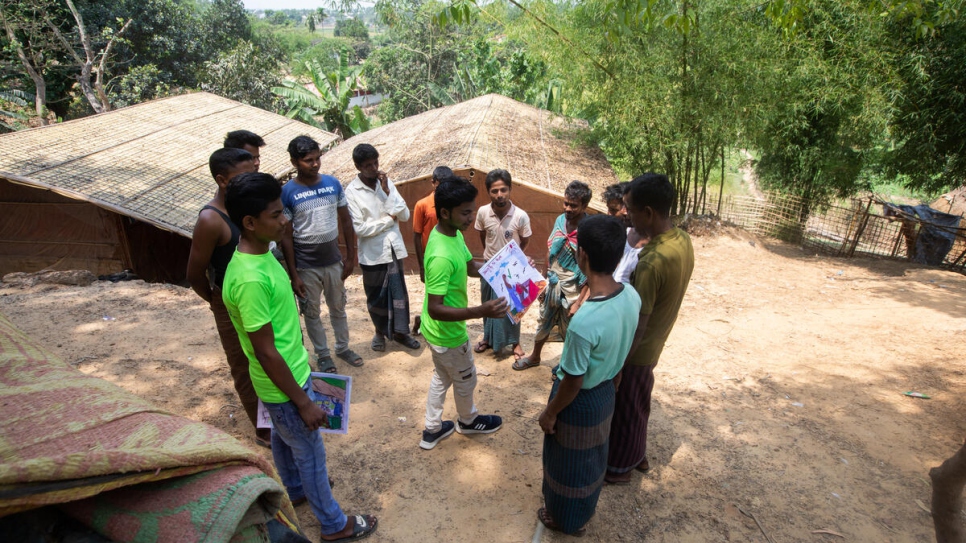 Mohammed Rofique (centre) and other members of his youth group are trying to improve waste management in their community through awareness raising. 