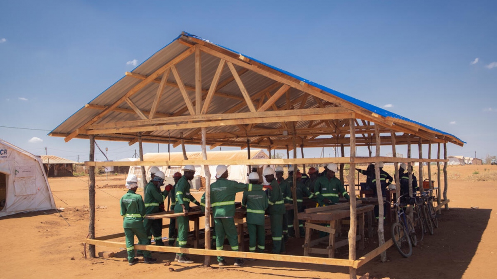 Electrification of the settlement has enabled residents to learn how to use power saws and other construction tools.