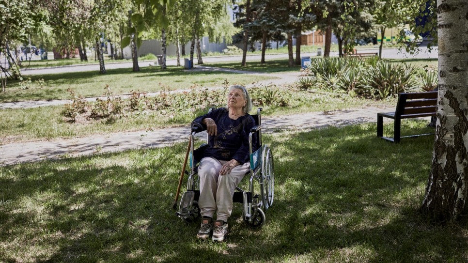 Svetlana enjoys the sunshine in the grounds outside her accommodation at MoldExpo.