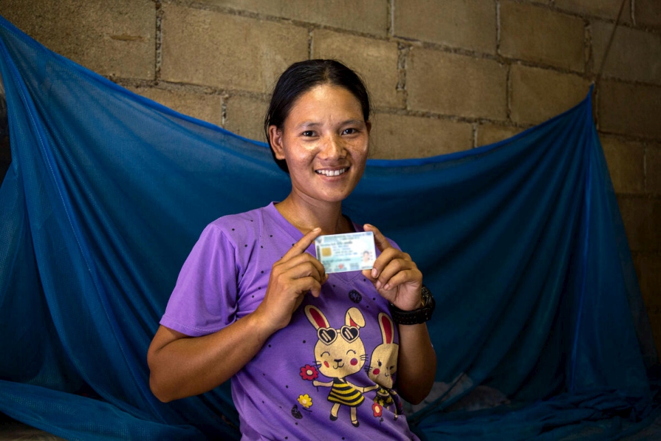 Thailand, Chiang Mai. Meepia Chumee, formerly stateless, shows off her new Thai ID.