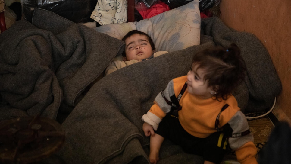 A baby sleeps at a school used as a collective shelter for families affected by the earthquake in the Salahadin neighbourhood of Aleppo, Syria.