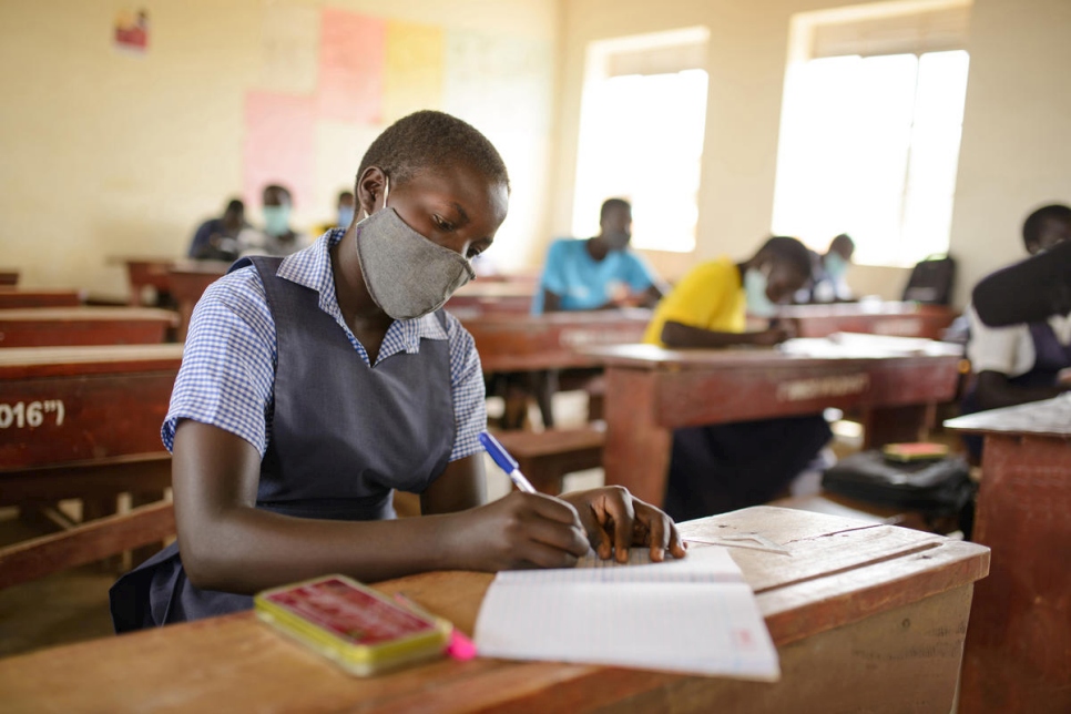 A South Sudanese refugee student attends primary school in a refugee settlement in Uganda.