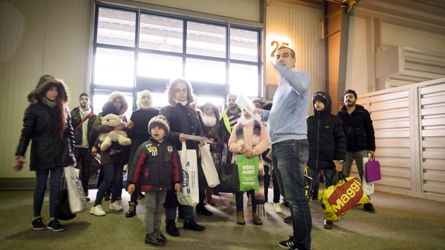 Germany. Syrian and non-Syrian resettlement refugees arrive via air charter at Hanover Airport.